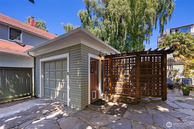 503 12th Ave E, Seattle, WA 98102 - view of home's exterior featuring an outdoor structure and a garage