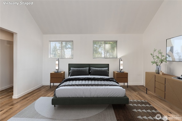 4715 N Island Dr E, Bonney Lake, WA 98391 - bedroom featuring lofted ceiling and wood finished floors