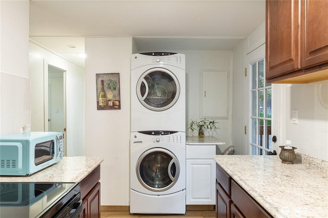 4715 N Island Dr E, Bonney Lake, WA 98391 - laundry area featuring estacked washer and dryer