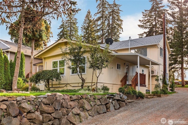 4715 N Island Dr E, Bonney Lake, WA 98391 - view of front of home with a shingled roof