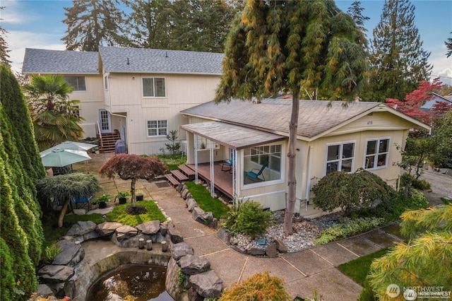 4715 N Island Dr E, Bonney Lake, WA 98391 - back of property with a shingled roof