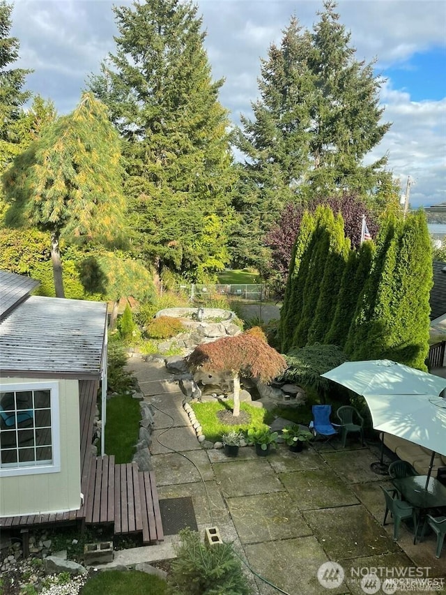 4715 N Island Dr E, Bonney Lake, WA 98391 - view of yard with a patio area