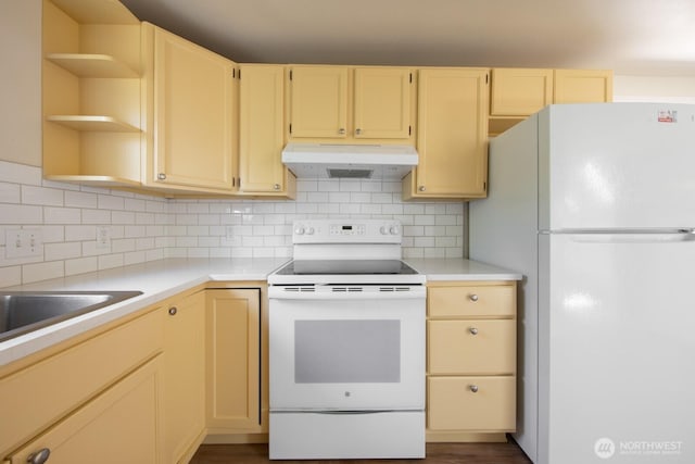 3827 Wetmore Ave, Everett, WA 98201 - kitchen featuring white appliances, under cabinet range hood, light countertops, and backsplash