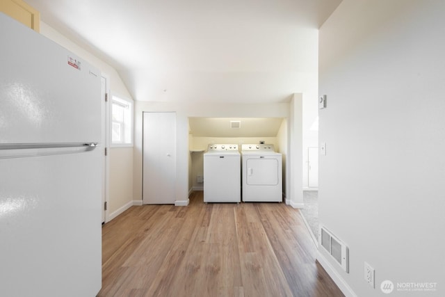 3827 Wetmore Ave, Everett, WA 98201 - laundry area featuring separate washer and dryer and light wood-type flooring