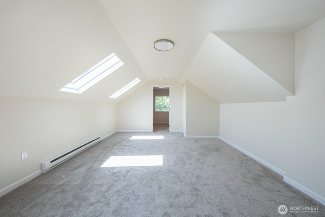 3827 Wetmore Ave, Everett, WA 98201 - additional living space featuring a baseboard heating unit, a skylight, vaulted ceiling, and carpet floors