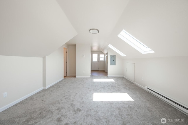 3827 Wetmore Ave, Everett, WA 98201 - additional living space with a baseboard heating unit, a skylight, electric panel, vaulted ceiling, and carpet