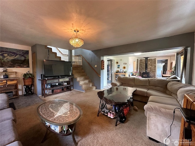 715 Copalis Beach Rd, Copalis Beach, WA 98535 - carpeted living room with a wood stove and stairway