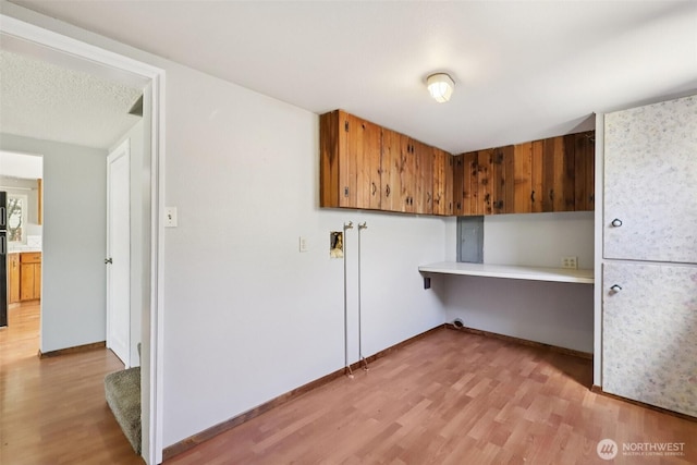 1425 N 1st Ave, Kelso, WA 98626 - laundry area with light wood-style floors and electric panel