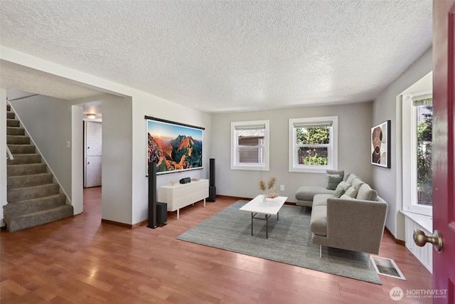 1425 N 1st Ave, Kelso, WA 98626 - living room featuring a textured ceiling, wood finished floors, and stairway