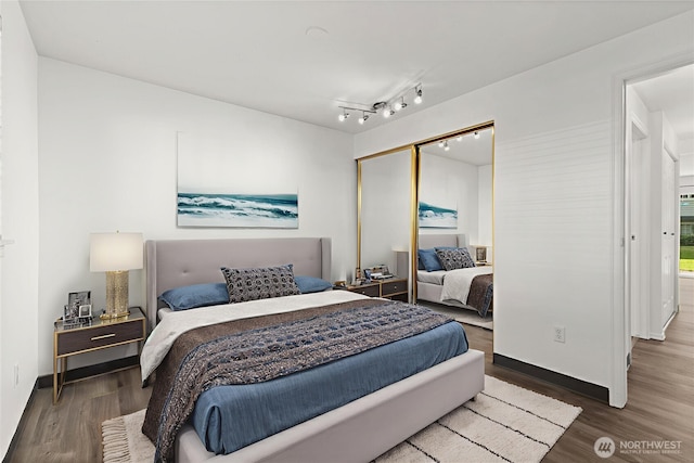 7453 Newcastle Golf Club Rd Unit L103, Newcastle, WA 98059 - bedroom featuring wood finished floors and a closet