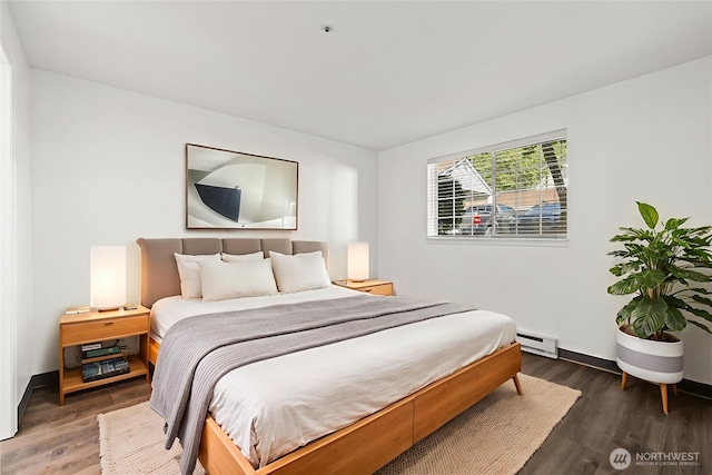 7453 Newcastle Golf Club Rd Unit L103, Newcastle, WA 98059 - bedroom with baseboard heating and wood finished floors
