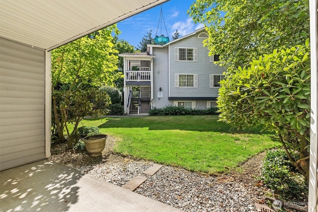 7453 Newcastle Golf Club Rd Unit L103, Newcastle, WA 98059 - view of green lawn featuring stairway and a balcony