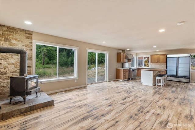 932 Tipsoo Loop N, Rainier, WA 98576 - living area with recessed lighting, light wood-type flooring, and a wood stove