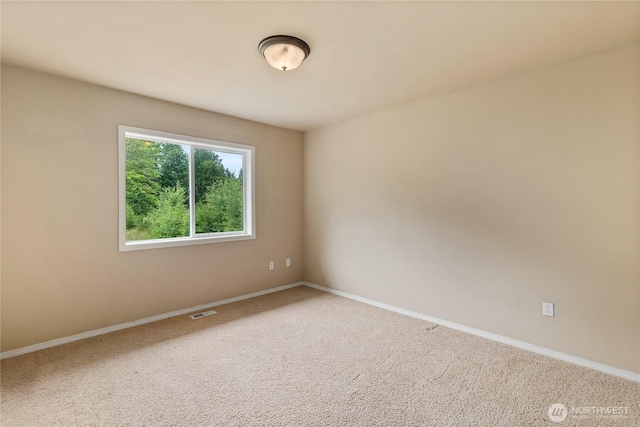 932 Tipsoo Loop N, Rainier, WA 98576 - spare room with baseboards and carpet floors