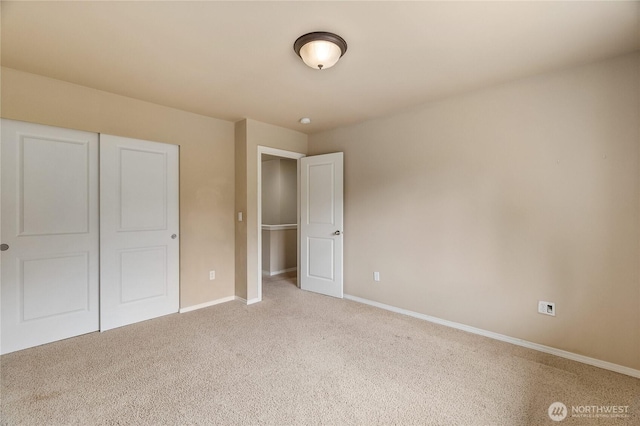 932 Tipsoo Loop N, Rainier, WA 98576 - unfurnished bedroom with light colored carpet and a closet