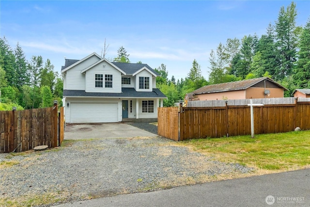 932 Tipsoo Loop N, Rainier, WA 98576 - traditional-style home with a garage, driveway, and a shingled roof