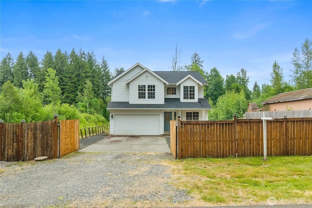 932 Tipsoo Loop N, Rainier, WA 98576 - traditional-style home featuring driveway, an attached garage, and roof with shingles