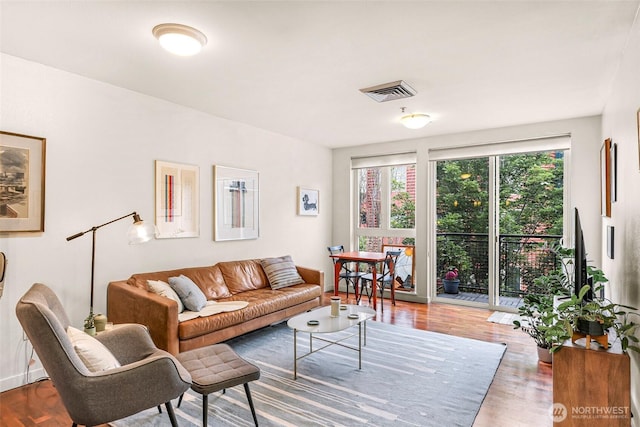 3104 Western Ave Unit 610, Seattle, WA 98121 - living room with wood finished floors and baseboards