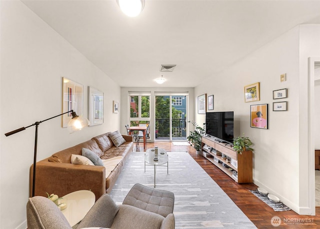 3104 Western Ave Unit 610, Seattle, WA 98121 - living room with dark wood-style flooring and baseboards