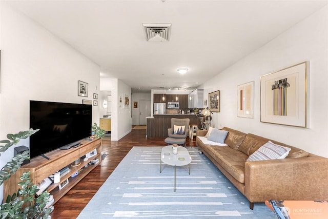 3104 Western Ave Unit 610, Seattle, WA 98121 - living room featuring dark wood finished floors and baseboards