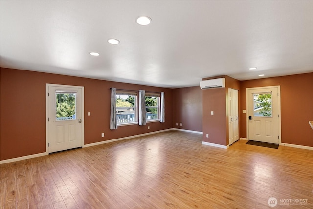 1229 14th St, Port Townsend, WA 98368 - entryway featuring a wall unit AC, recessed lighting, and light wood finished floors