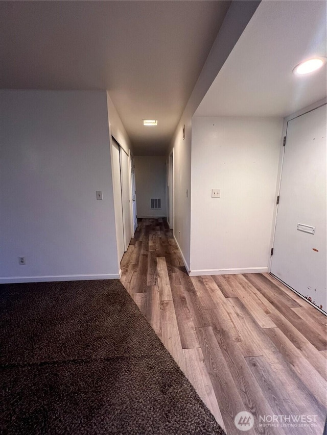 401 Biggs Dr, Moses Lake, WA 98837 - hall featuring wood finished floors and baseboards