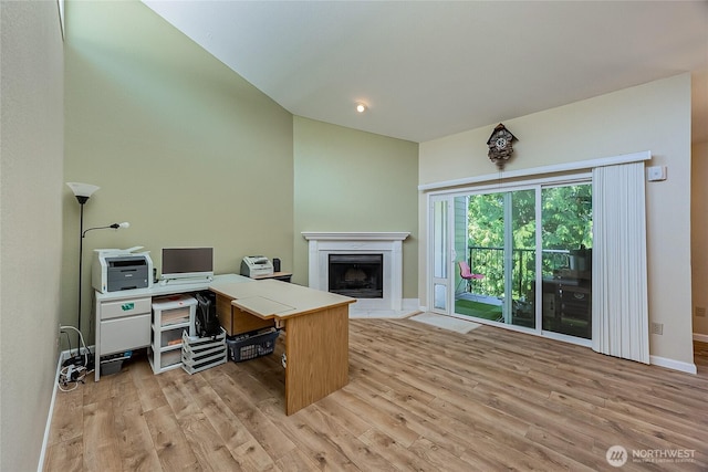 4164 Factoria Blvd SE Unit B11, Bellevue, WA 98006 - office area featuring vaulted ceiling, light wood-style floors, and a fireplace with flush hearth