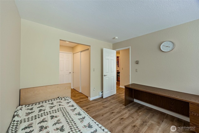 4164 Factoria Blvd SE Unit B11, Bellevue, WA 98006 - unfurnished bedroom with wood finished floors and a baseboard radiator