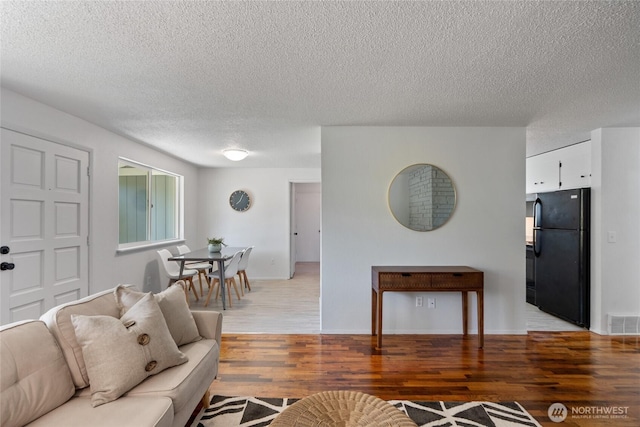 3317 N Baltimore St, Tacoma, WA 98407 - living room with a textured ceiling and light wood-type flooring