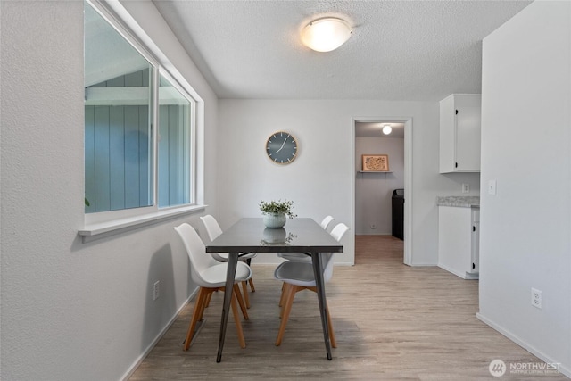 3317 N Baltimore St, Tacoma, WA 98407 - dining area featuring light wood finished floors and a textured ceiling