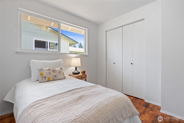 3317 N Baltimore St, Tacoma, WA 98407 - bedroom featuring a closet, wood finished floors, and a textured ceiling