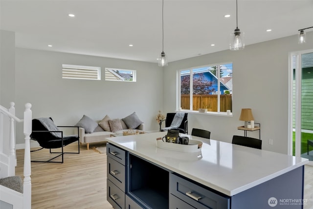 6410 S Fife St, Tacoma, WA 98409 - kitchen with light countertops, light wood-style floors, recessed lighting, and pendant lighting