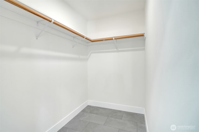 6410 S Fife St, Tacoma, WA 98409 - walk in closet with tile patterned flooring