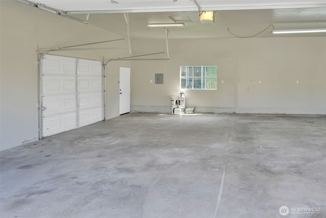 6410 S Fife St, Tacoma, WA 98409 - garage with electric panel and a garage door opener