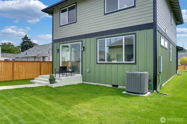 6410 S Fife St, Tacoma, WA 98409 - back of property with board and batten siding and a patio