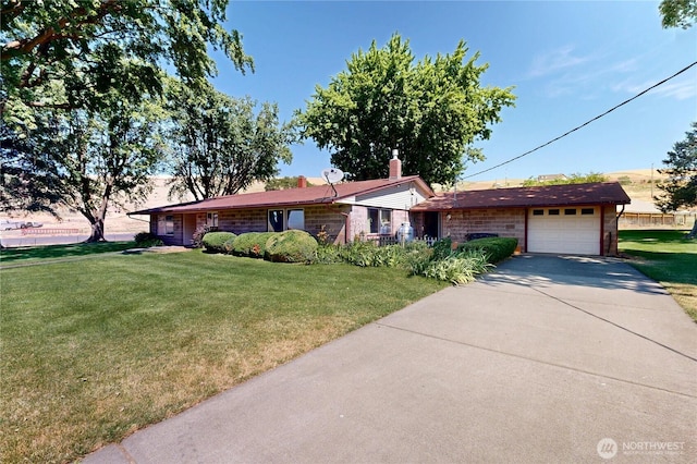 238 Patit Rd, Dayton, WA 99328 - ranch-style home featuring a garage, driveway, and a front lawn