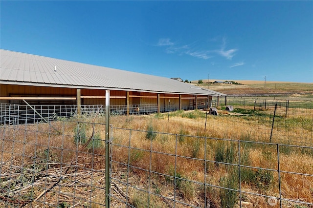238 Patit Rd, Dayton, WA 99328 - view of yard featuring an exterior structure, an outdoor structure, and a view of rural / pastoral area