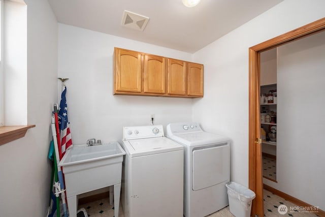 2207 W Depot Springs Rd, Spangle, WA 99031 - laundry area featuring cabinet space and separate washer and dryer