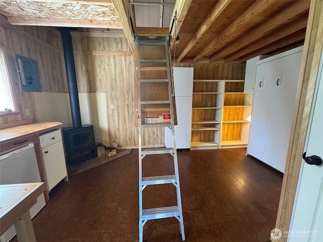 7379 Hideaway Ln, Anacortes, WA 98221 - interior space featuring electric panel, a wood stove, and dark wood-style floors
