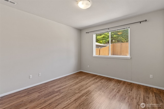 26195 21st Pl S, Des Moines, WA 98198 - empty room with wood finished floors and baseboards