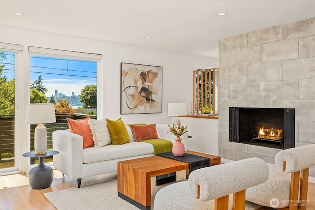 2434 64th Ave SE, Mercer Island, WA 98040 - living area featuring wood finished floors, a tiled fireplace, and recessed lighting