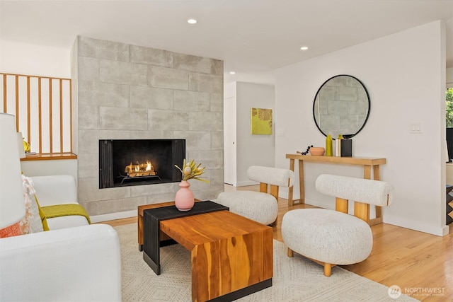 2434 64th Ave SE, Mercer Island, WA 98040 - living area featuring wood finished floors, a tiled fireplace, and recessed lighting