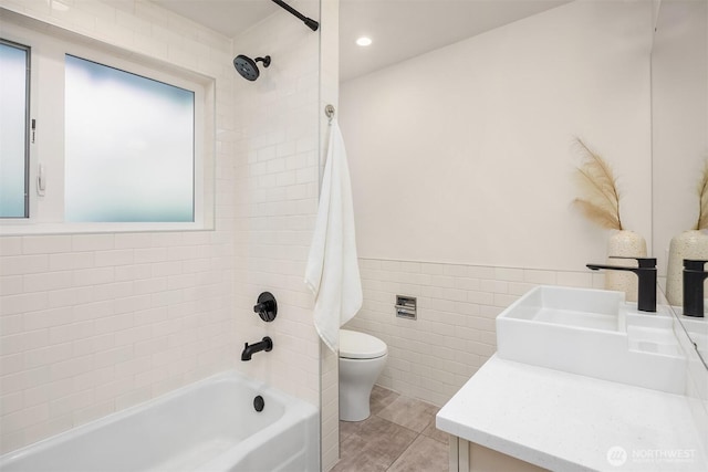 2434 64th Ave SE, Mercer Island, WA 98040 - bathroom featuring vanity, tile walls, shower / bathtub combination, wainscoting, and recessed lighting