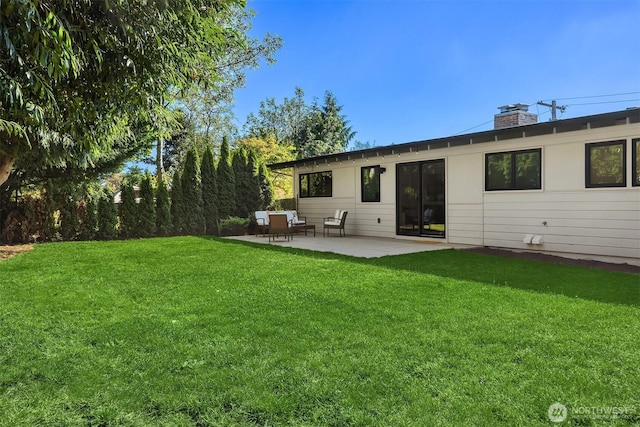 2434 64th Ave SE, Mercer Island, WA 98040 - rear view of property featuring a patio area, a yard, and a chimney
