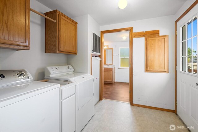 101 Twin Lakes Rd, Cle Elum, WA 98922 - laundry room featuring washer and clothes dryer, cabinet space, and light floors