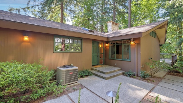 9411 SE 54th St, Mercer Island, WA 98040 - property entrance with a shingled roof and a chimney
