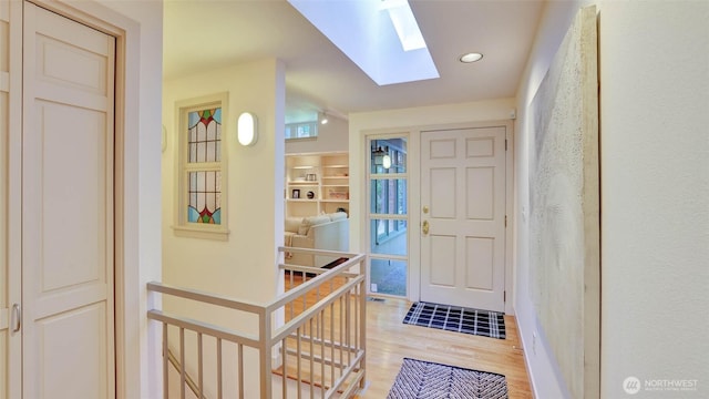 9411 SE 54th St, Mercer Island, WA 98040 - entryway with a skylight, light wood-style floors, and recessed lighting