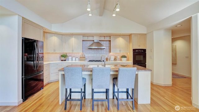 9411 SE 54th St, Mercer Island, WA 98040 - kitchen with black appliances, wall chimney exhaust hood, light wood-style floors, a breakfast bar area, and lofted ceiling