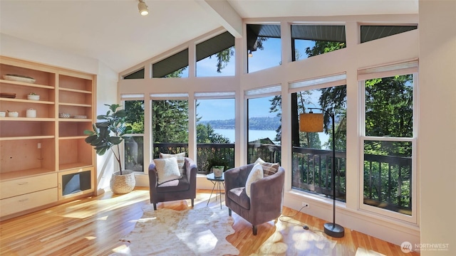9411 SE 54th St, Mercer Island, WA 98040 - living area featuring beamed ceiling, wood finished floors, a water view, and high vaulted ceiling