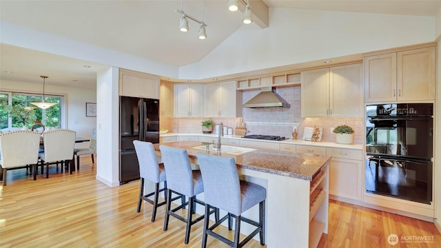 9411 SE 54th St, Mercer Island, WA 98040 - kitchen featuring exhaust hood, black appliances, lofted ceiling, light wood-style flooring, and backsplash